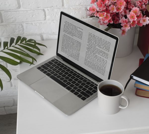 high-angle-laptop-books-arrangement